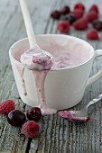 Raspberry yoghurt in a white cup