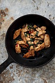 Chicken with Thai basil in a pan