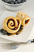 Pork fillet wrapped in puff pastry with blueberries