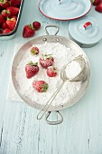 Strawberries with icing sugar