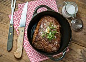 Roast beef with rosemary and garlic in a pot