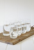 Glasses of water on a chopping board