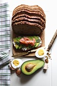 Bread topped with avocado, smoked salmon and hard-boiled egg