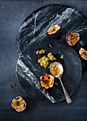 Passion fruit on two marble platters