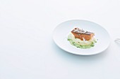 Salmon trout on mashed potatoes with chive foam and horseradish