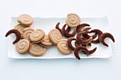 Spiced spiral biscuits and chilli and nut crescent biscuits