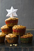 A stack of turmeric muffins with a paper star