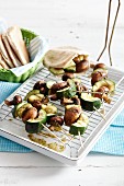 Grilled vegetable and mushroom skewers with pita bread