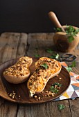Butternut squash filled with breadcrumbs and Parmesan cheese garnished with parsley