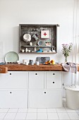 Kitchen unit made from old workbench and white cabinets