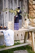 Mediterranean arrangement of ornaments on rustic wooden bench