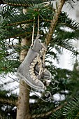 Metal ice-skate ornaments hung on Christmas tree