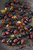 Dried olives with garlic and bay leaves