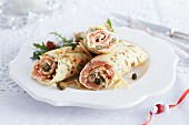 Crêpes filled with salmon, vegetables and capers