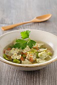 Clear vegetable soup with ravioli
