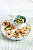 Tortilla corners with salmon and guacamole