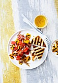 Grilled bread with a watermelon and sweetcorn salad