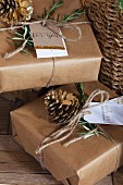 Gifts wrapped in brown paper, parcel string and hand-made gift tags