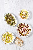 Four types of labneh with olive oil and unleavened bread