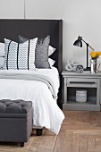 Classic furnishings in bedroom in shades of grey