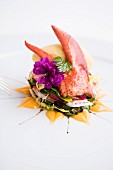 A lobster and melon sorbet on a herb salad