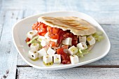 Pita bread with feta cheese, tomatoes and lettuce