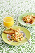 Scrabbled eggs with shrimps and breadsticks