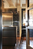 View into elegant kitchen with rustic wooden floor