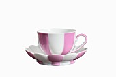 A pink-and-white striped espresso cup