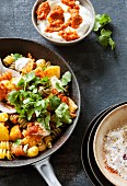 Colourful fried pasta with pumpkin and spicy harissa