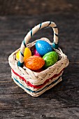 Colourful eggs in a basket for Easter
