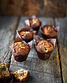 Blueberry and pistachio muffins on a wire rack