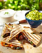 Quesadillas with oven-roasted vegetables, guacamole and sour cream (Mexico)