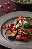 Aubergines with chickpeas, mint chutney and pomegranate seeds