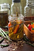 Asparagus and peppers with pickling spices in a vintage preserving jar