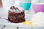 Chocolate cake with egg liqueur and whipped cream