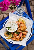 Fried herbs and tomatoes with tzatziki