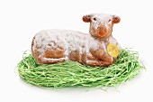 A baked Easter lamb on decorative grass