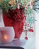 Wire, , vintage-style Christmas tree decoration hanging from pine branch