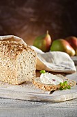 Chia and spelt bread with cream cheese, oregano and pears