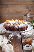 Citrus cake with icing sugar and candied orange peel