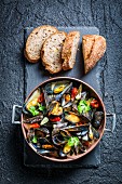 Roasted mussels with garlic served with bread
