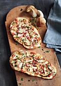 Tarte flambée with porcini mushrooms, bacon and red onions
