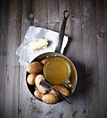 Ingredients for potato soup: potatoes, stock and butter