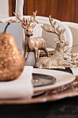 Christmas dinner table decorated with gold ornaments