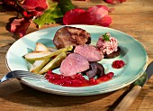 Venison fillet with pears and lingonberry sauce
