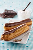 Eclairs with chocolate sauce