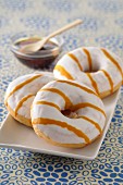 Doughnuts with white glaze and caramel sauce