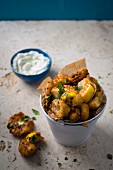 Pattypan fritters with a garlic and herb dip