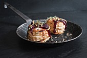 Goat's cheese vol-au-vents with lingonberries and crispy meal worms